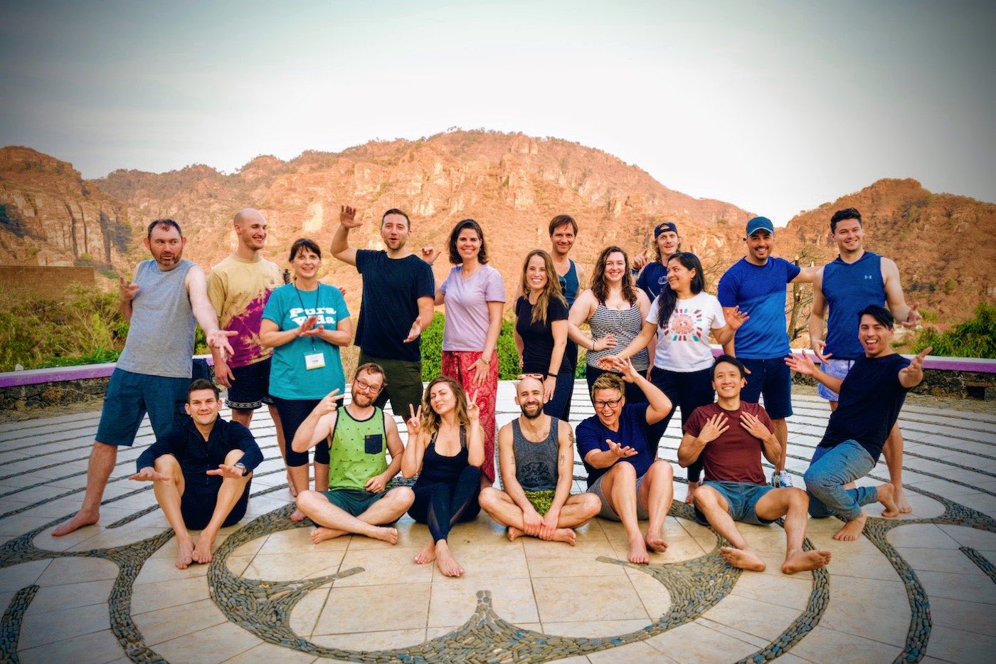 Group on the labyrinth with golden mountains behind