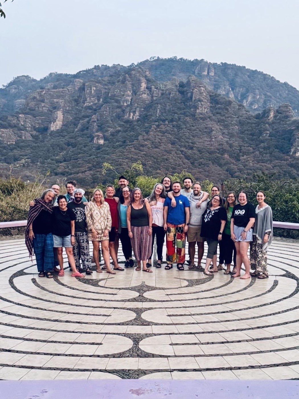 Larger group on the labyrinth beneath the mountains