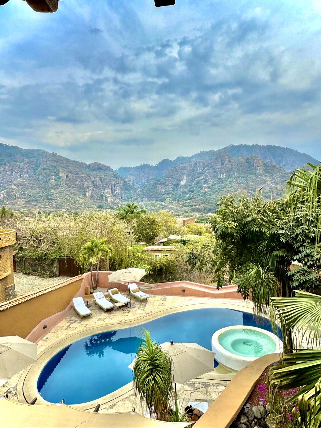 Pool, loungers, and mountain view