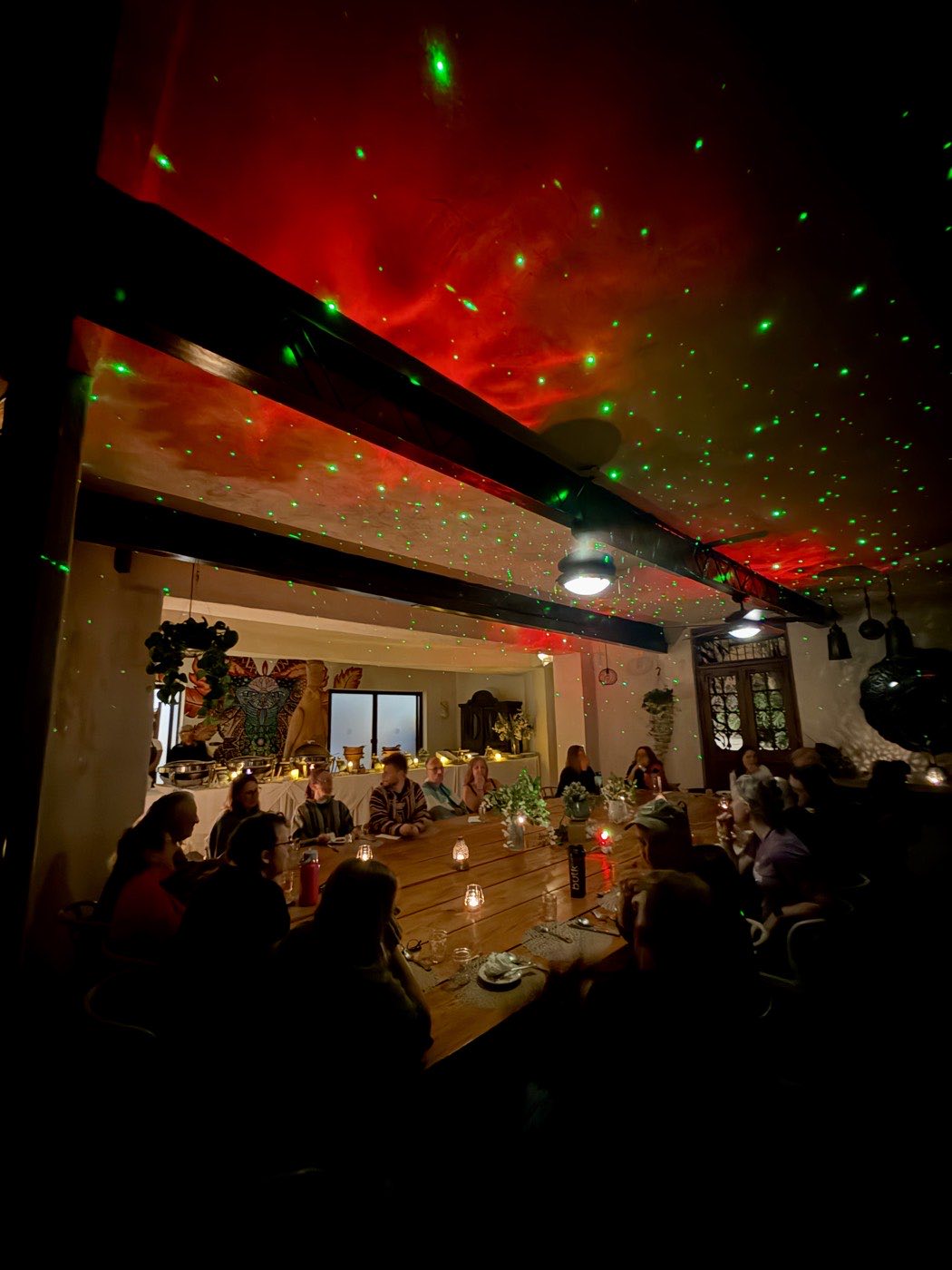 Seated circle beneath red and green lights